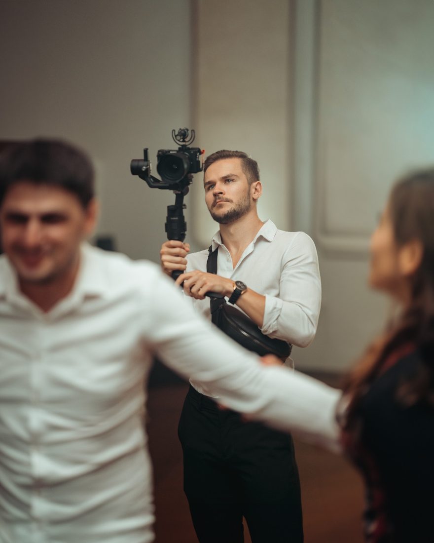 Ionut shooting at an event with a professional camera on a gimbal